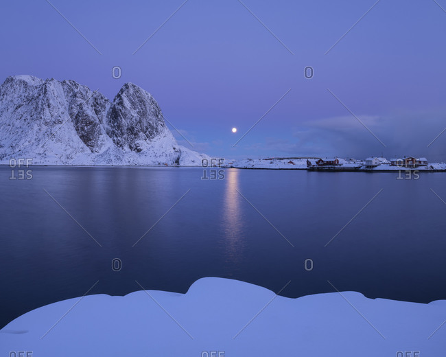 Winter moonrise in pastel twilight over Hamnøy, Moskenesøy, Lofoten Islands, Norway