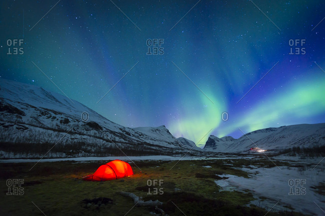 Northern Lights (Aurora borealis) over a tent in winter, Kungsleden or Kˆnigsweg, Province of Lapland, Sweden, Europe
