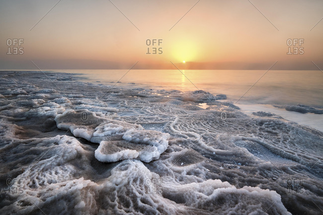 Shore with deposited salt crust, sunset at the Dead Sea, West Bank, Israel, Asia