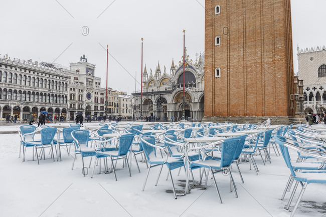 Venice, Italy - March 1, 2018: Snowy chairs on Piazza San Marco
