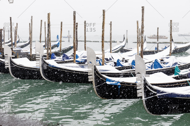Gondolas covered by snow, Venice, Italy