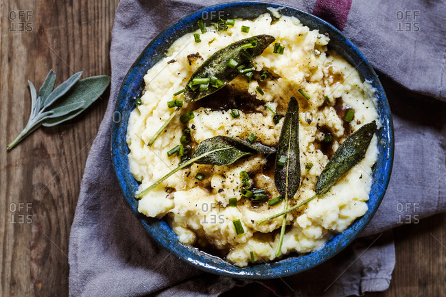 Bowl of mashed potatoes with burnt butter- sage and chive