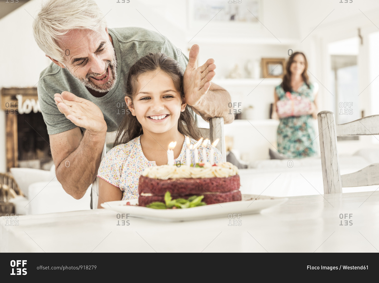 Father and mother celebrating daughter's birthday