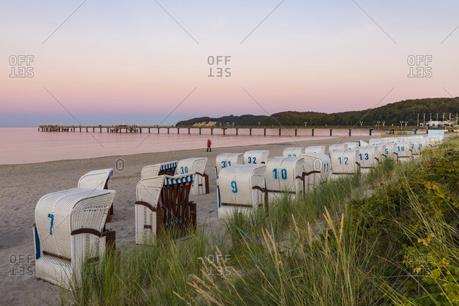 Germany- Mecklenburg-West Pomerania- Rugen Island- Binz- Ostseebad- Wicker beach chairs on beach at sunset