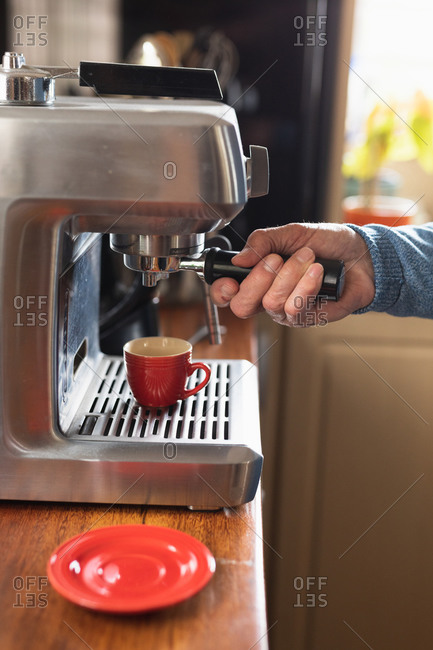 Modern coffee machine on table in kitchen Stock Photo by ©serezniy