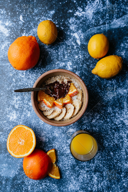 Oatmeal with chia seed, bananas and oranges