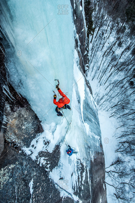 Man ice climbing on Cathedral Ledge in North Conway, New Hampshire