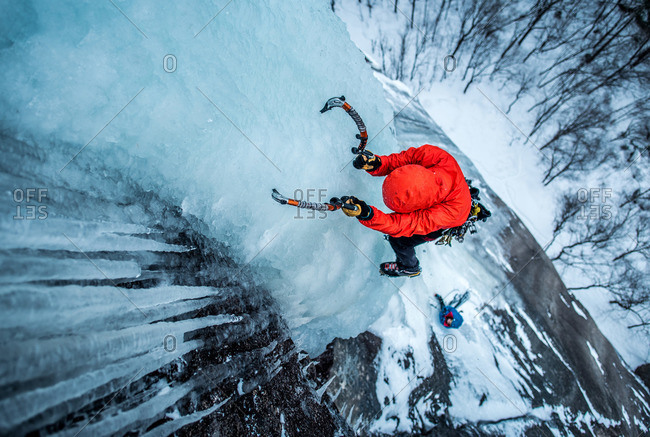 Man ice climbing on Cathedral Ledge in North Conway, New Hampshire