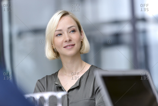 Attentive businesswoman sitting meeting- listening focused