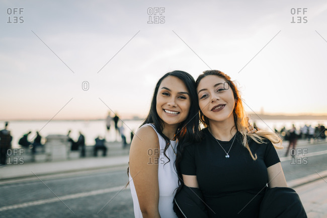 Portrait of two friends head to head at sunset- Lisbon- Portugal