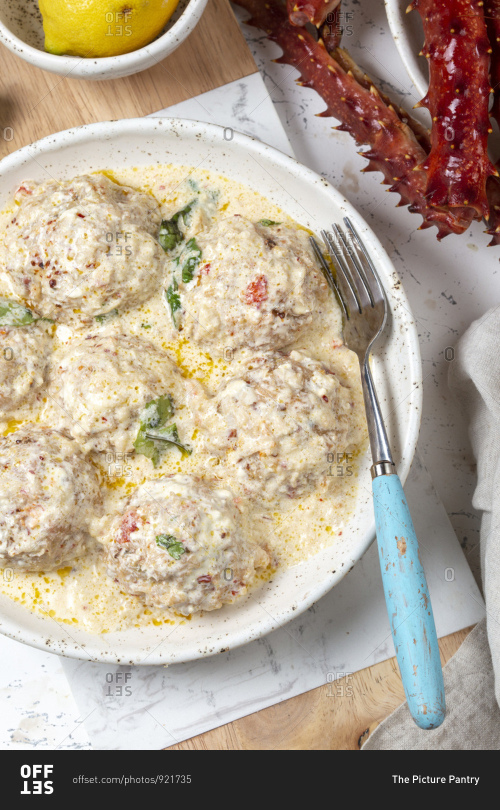 Crab meat balls in creamy sauce stock photo OFFSET
