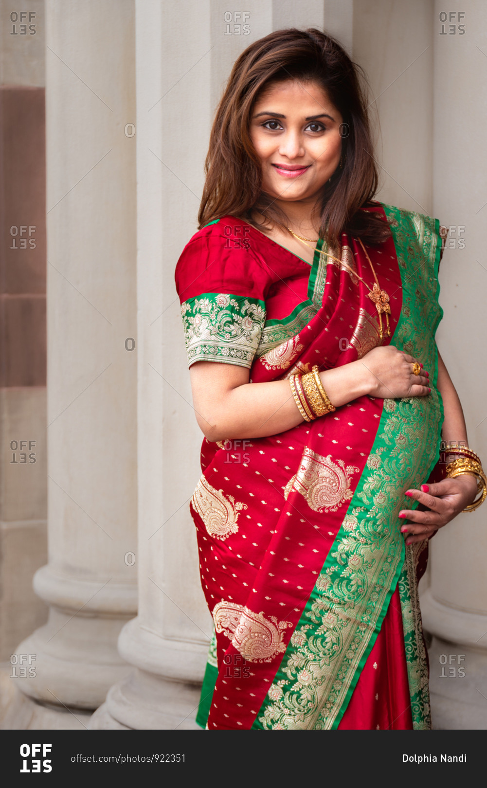 Portrait of a beautiful pregnant woman wearing a saree stock photo