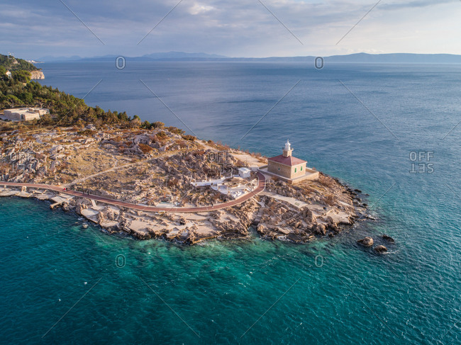 Aerial view of famous lighthouse and Adriatic sea coastline in the city of Makarska in Dalmatia, Croatia. Lighthouse is situated on the St. Peter peninsula.