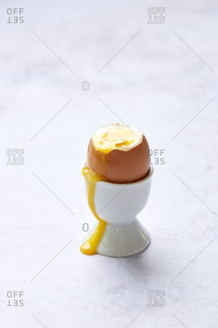 Soft Boiled Egg in and Egg Cup with Oozing Yolk