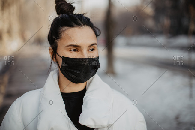 Woman wearing protective face mask in the city