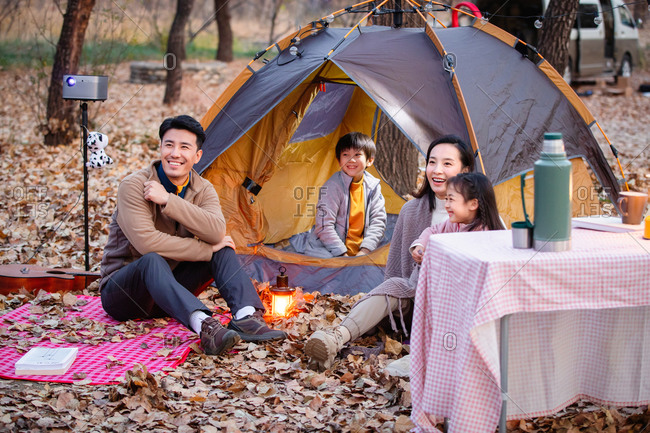 Happy family camping in the open air