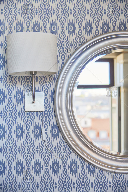 Interior design detail of mirror and wall lamp, Lisbon