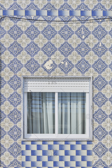 Cabanas de Tavira, Portugal - January 26, 2020: Home with decorated tile around window in Tavira, Algarve, Portugal