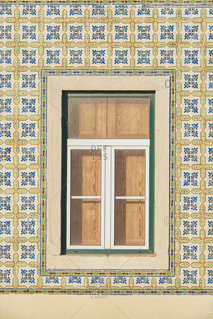 Window surrounded by decorative tile - Lisbon - Portugal
