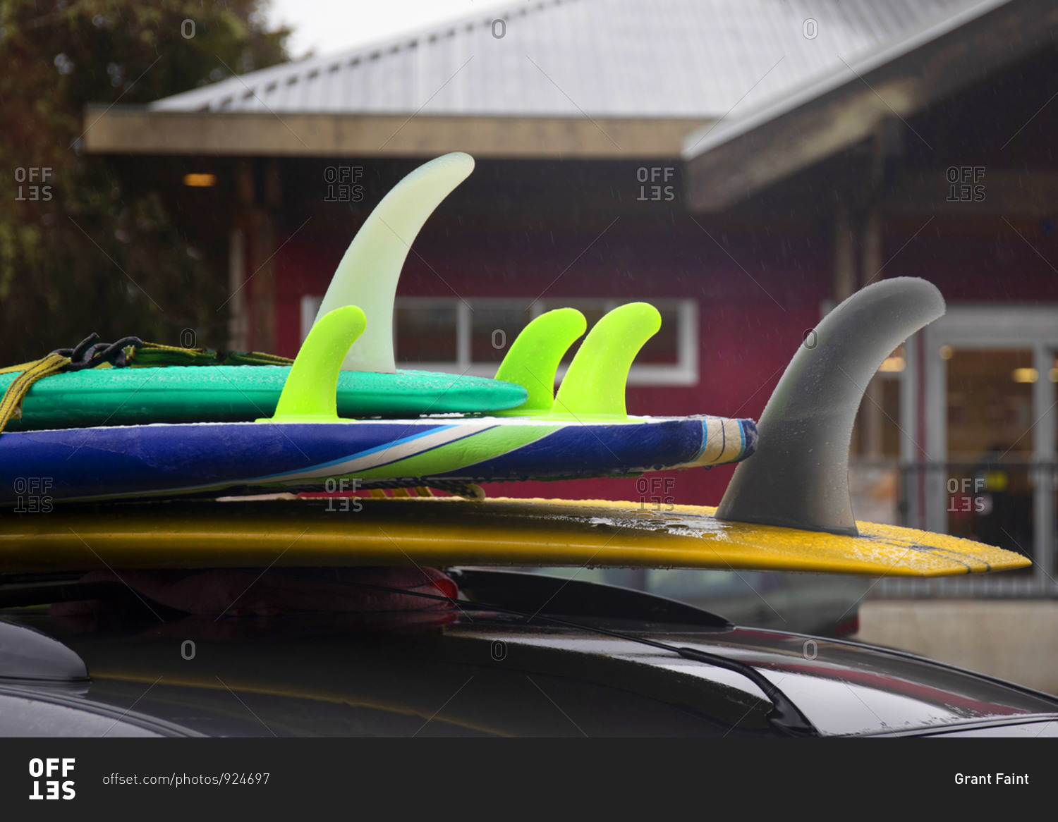 Rack of surfboards tied to top of car in Tofino, Vancouver Island