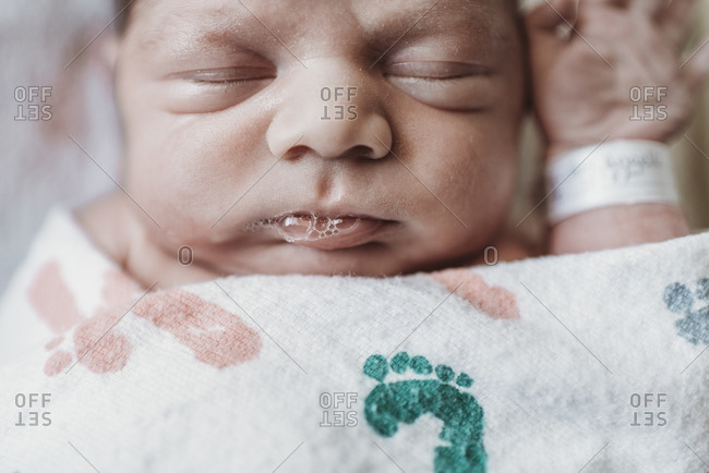 Close up detail of newborn boy face in hospital