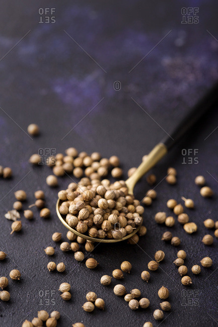 White peppercorn spice in the spoon with copy space