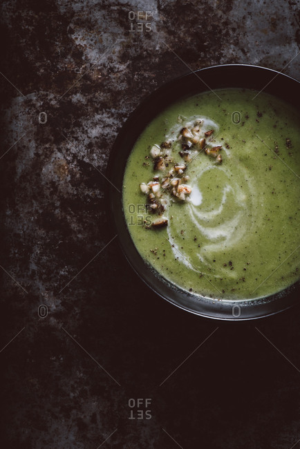 Spring pea soup on dark background