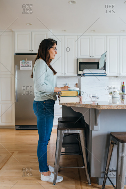 Woman working from home in the kitchen