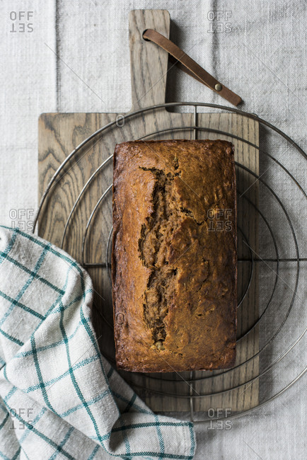 Fresh Whole Wheat Banana Bread sitting on a cooling rack.