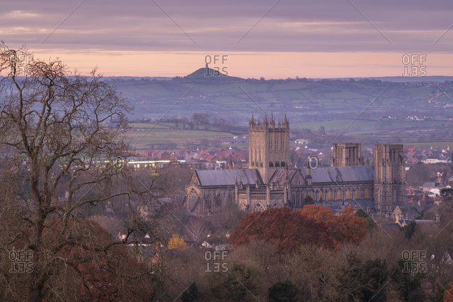 Wells Cathedral and Glastonbury Tor at dawn in winter, Wells, Somerset, England, United Kingdom, Europe