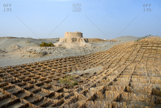 Straw sand control barriers around the 4th century Rawak Buddhist stupa, Hotan, Xinjiang, China, Asia