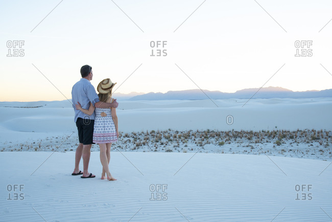 A couple enjoy White Sands National Park at sunset, New Mexico, United States of America, North America