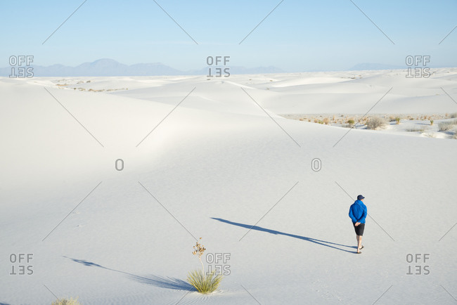 A man exploring the vast landscape of White Sands National Park, New Mexico, United States of America, North America