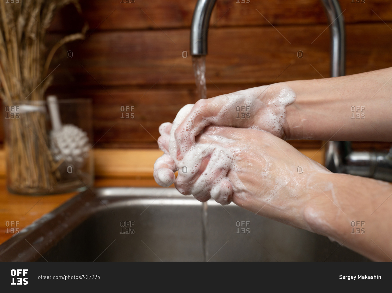 Woman washing her hands with foam and bubbles to protect herself from the covid-19 virus