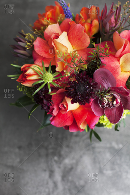Aerial view of floral arrangement with orange roses and orchids