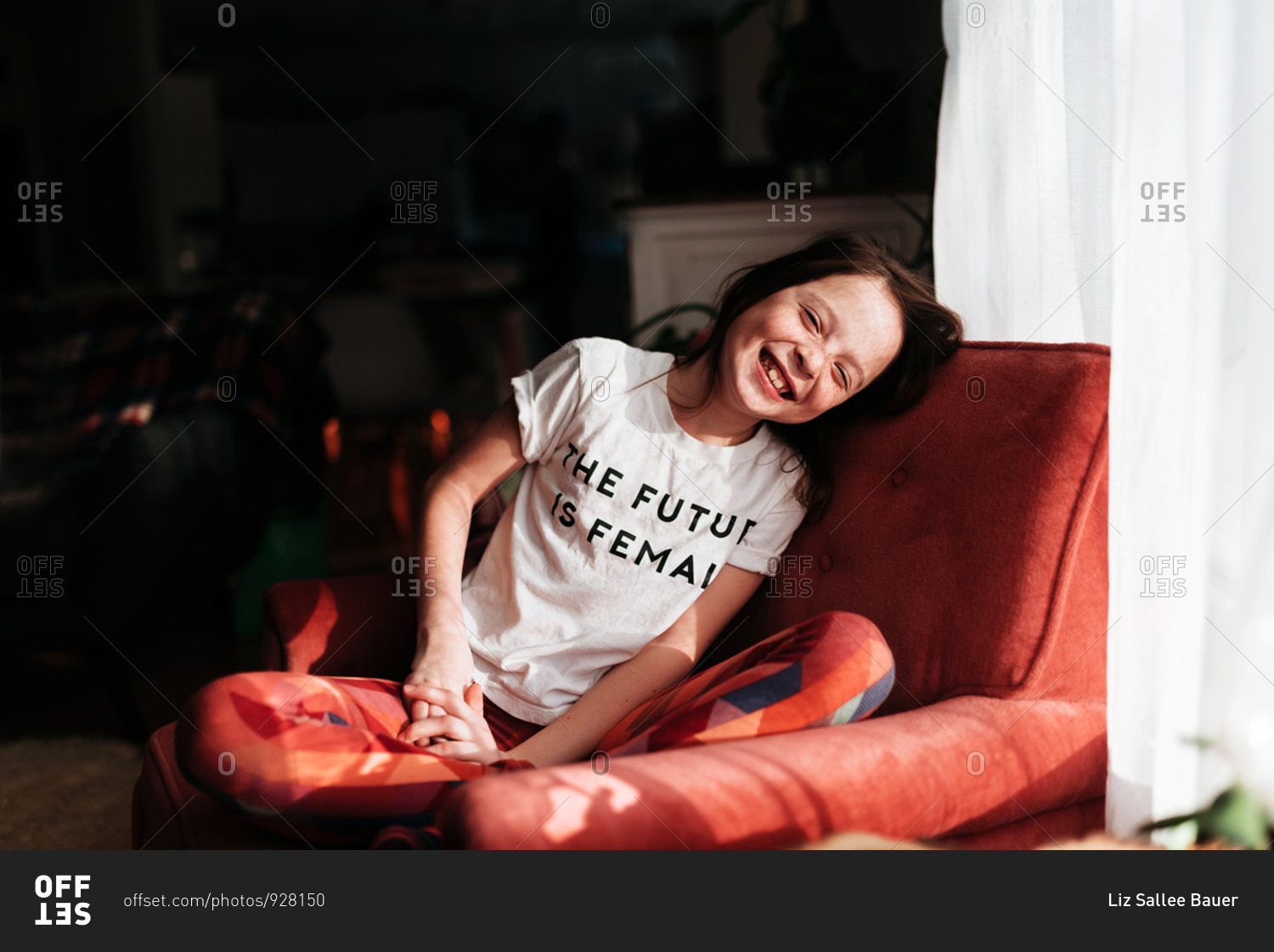 Portrait of a smiling young girl with a shirt that says \