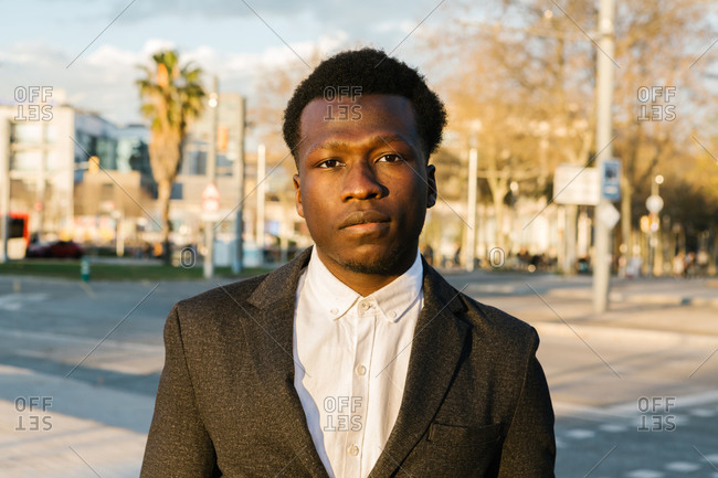 Portrait of an african businessman wearing a suit at sunset