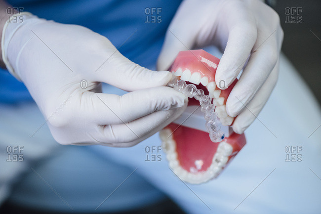 Close-up of dentist working on dentures