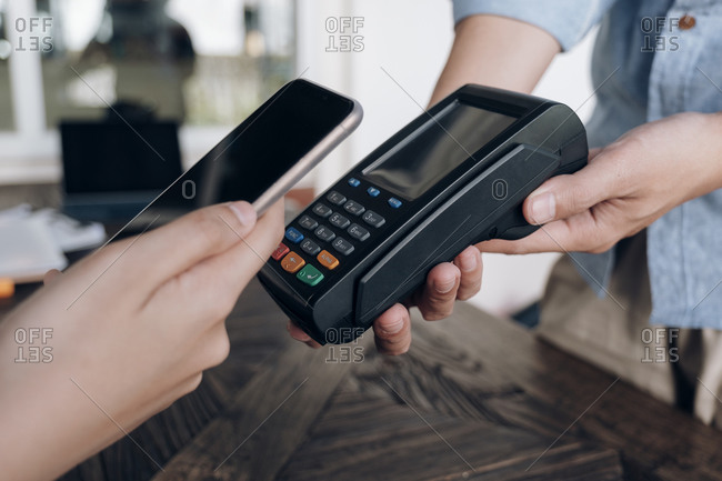 Paying bill through smartphone using NFC technology.