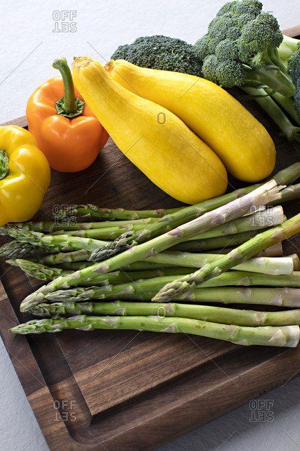 Variety of fresh vegetables on a cutting board