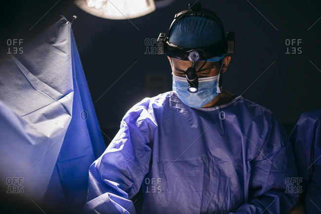 Male surgeon during an operation