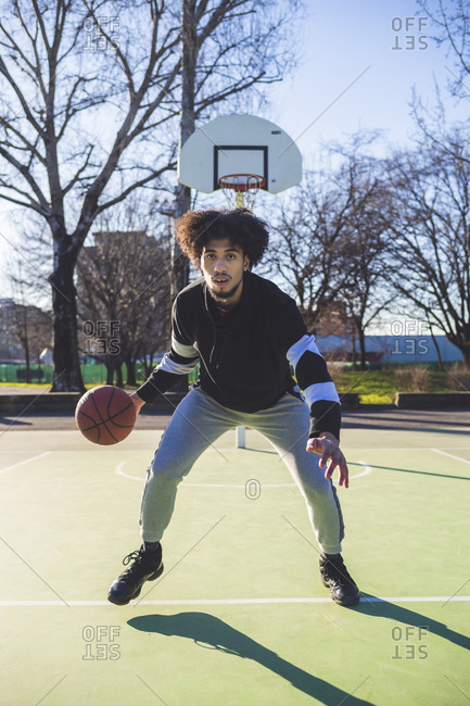 Portrait of basketball player in action on court