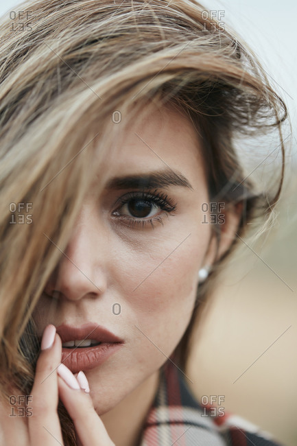 Portrait of a beautiful woman with her hair flipped to one side
