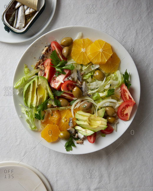 Overhead view of salad with olives, orange and avocado