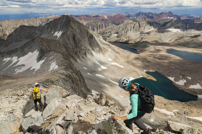Women descend ridge on Capitol Peak, Elk Mountains, Colorado