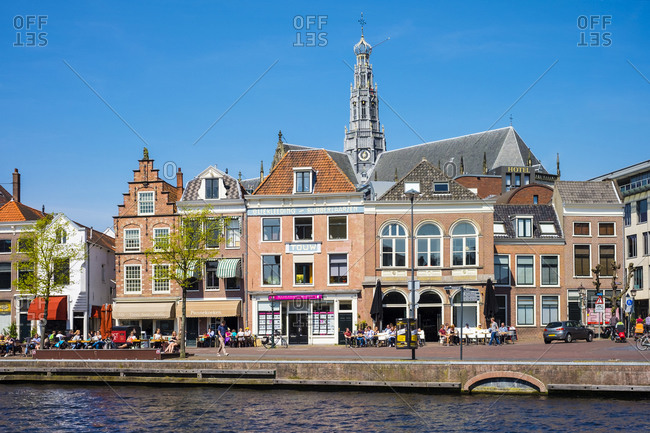 Haarlem, North Holland, Netherlands - May 6, 2016: Buildings along the Spaarne River, Haarlem, North Holland, Netherlands