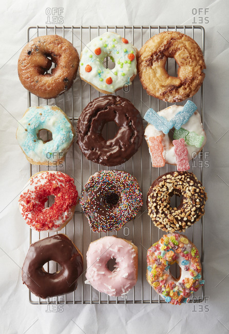 Dozen Colorful Donuts Freshly Baked and Decorated