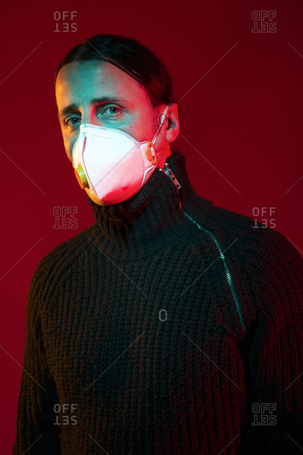 Dramatic studio portrait representing new life with a mask