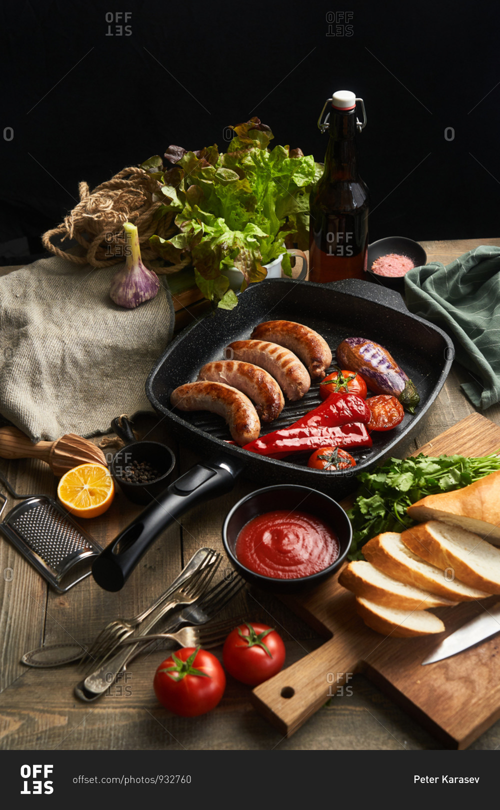 Sausage and fresh veggies in a skillet on rustic table