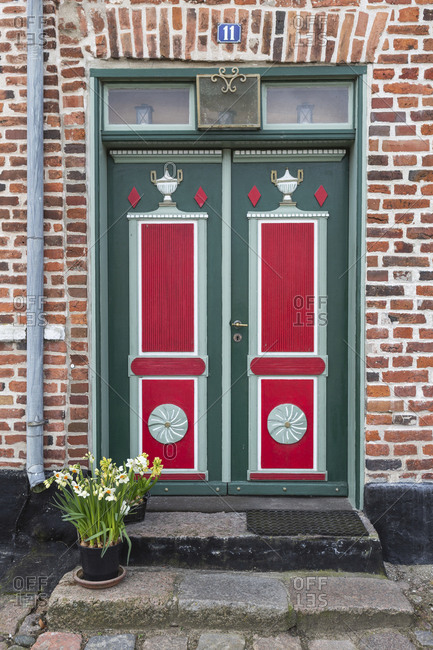 April 11, 2017: Denmark- Ribe- Ornate entrance doors of brick town house